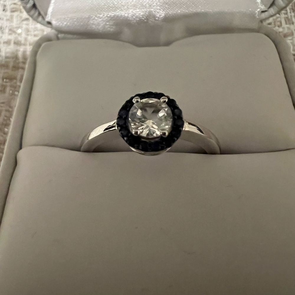 Brilliant White & Blue Sapphire Halo Ring
Size:7 Sterling Silver